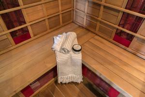 
a room with a wooden floor and wooden walls at Brasss Hotel Suites in Haarlem
