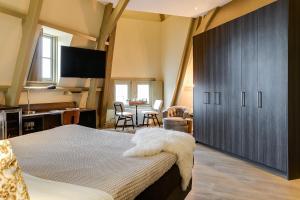 Voodi või voodid majutusasutuse Brasss Hotel Suites toas