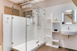 Vannituba majutusasutuses Brasss Hotel Suites