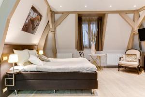 Voodi või voodid majutusasutuse Brasss Hotel Suites toas