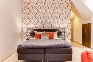 Voodi või voodid majutusasutuse Brasss Hotel Suites toas