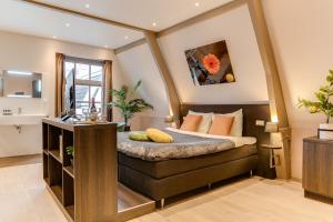 Voodi või voodid majutusasutuse Brasss Hotel Suites toas