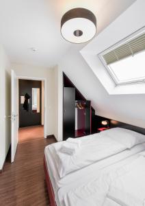 Кровать или кровати в номере Haus Scharhoern_Riff _ Fewo 18