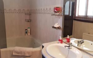 a bathroom with a sink and a bath tub at Apartamento Mediterraneo in Pineda de Mar +38 photos