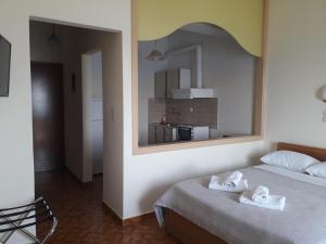 Postel nebo postele na pokoji v ubytování Poseidon Hotel