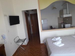 Postel nebo postele na pokoji v ubytování Poseidon Hotel