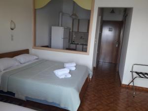 Postel nebo postele na pokoji v ubytování Poseidon Hotel