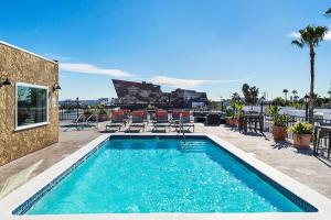 a swimming pool on the roof of a building at Prime Location 1-Bedroom with Balcony and Pool in Los Angeles