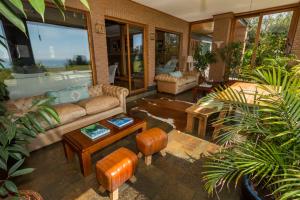 a living room with a couch and a table at Casa Molino Hotel Boutique & Restaurant in Puerto Varas