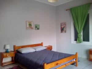 A bed or beds in a room at Marilena House Plataria