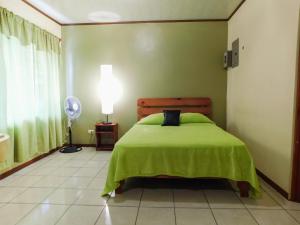 Cama o camas de una habitación en Hotel Amjeco