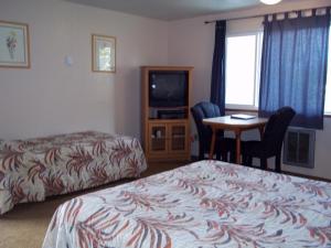 Postel nebo postele na pokoji v ubytování Ocean Avenue Inn