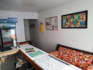 a shop with a counter and a counter top at Victoria's Gennie Bay Village Hostal in San Andrés