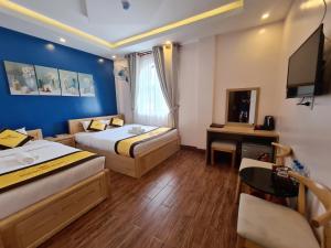 Postel nebo postele na pokoji v ubytování Hoàng Gia Hotel Côn Đảo