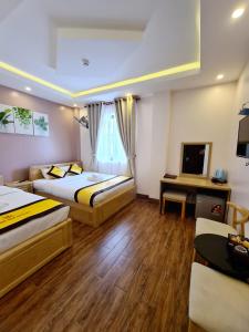 Postel nebo postele na pokoji v ubytování Hoàng Gia Hotel Côn Đảo