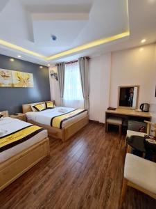 Postel nebo postele na pokoji v ubytování Hoàng Gia Hotel Côn Đảo
