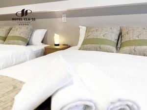 Postel nebo postele na pokoji v ubytování HOTEL CLA-SS HIROSHIMA-OZU