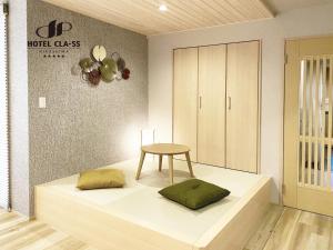 Postel nebo postele na pokoji v ubytování HOTEL CLA-SS HIROSHIMA-OZU