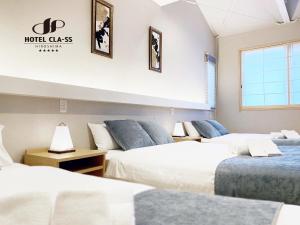 Postel nebo postele na pokoji v ubytování HOTEL CLA-SS HIROSHIMA-OZU