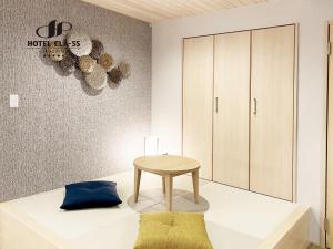 Postel nebo postele na pokoji v ubytování HOTEL CLA-SS HIROSHIMA-OZU