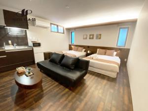 Postel nebo postele na pokoji v ubytování HOTEL CLA-SS HIROSHIMA-OZU