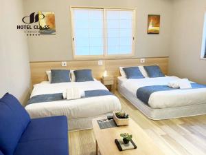 Postel nebo postele na pokoji v ubytování HOTEL CLA-SS HIROSHIMA-OZU