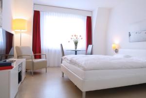 Ein Bett oder Betten in einem Zimmer der Unterkunft City Stay Furnished Apartments - Forchstrasse