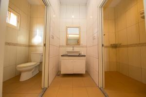 a bathroom with a toilet and a sink at Nangou Speciality B&B in Xiaoliuqiu +38 photos