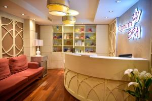 a salon with a couch and a waiting room at Regnum Bansko Ski Hotel & SPA in Bansko