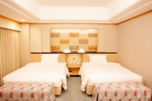 Postel nebo postele na pokoji v ubytování Hotel New Otani Makuhari