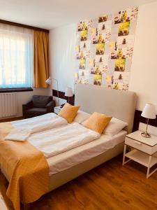 a bedroom with a large bed in a room at Hotel Gloria Budapest City Center in Budapest