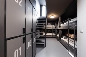 a hallway with bunk beds in a dorm room at BOOK1 by Brøchner Hotels in Aarhus