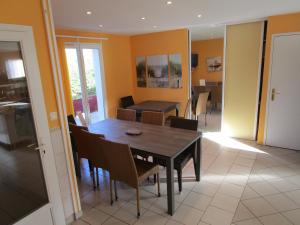 a dining room with a table and chairs at Locatlantique in Aytré