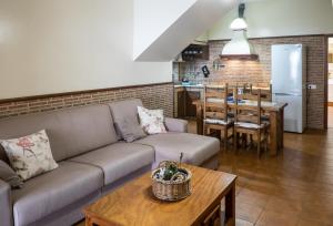 a living room with a couch and a table at Loft Rustico in Corralejo