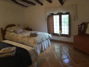 Ένα ή περισσότερα κρεβάτια σε δωμάτιο στο Cortijo Esquina B&B Guesthouse