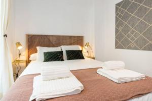 Postel nebo postele na pokoji v ubytování TGH/ Málaga center luxury style