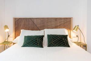 Postel nebo postele na pokoji v ubytování TGH/ Málaga center luxury style