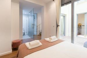 Postel nebo postele na pokoji v ubytování TGH/ Málaga center luxury style