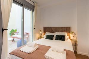 Postel nebo postele na pokoji v ubytování TGH/ Málaga center luxury style