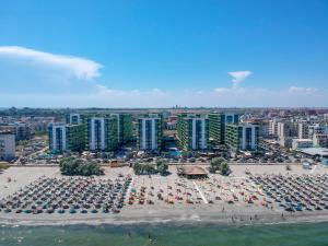 an aerial view of a beach with chairs and umbrellas at Alezzi Beach Resort in Mamaia Nord