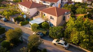 an aerial view of a house with cars parked on a street at Morena in Pula
