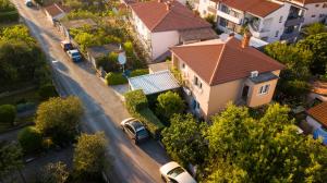 an overhead view of a house with cars parked in a street at Morena in Pula