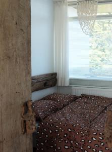 Postel nebo postele na pokoji v ubytování Kuta Beach