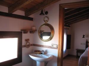 
a bathroom with a sink and a mirror at Antiguas Eras La Alberca in La Alberca
