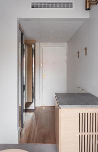 a kitchen with white walls and a counter top at Copenhagen Admiral Hotel in Copenhagen