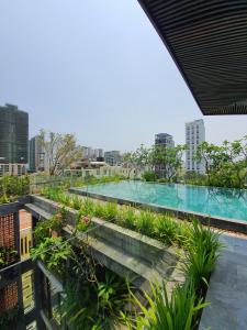 a swimming pool on the roof of a building at Minh Boutique in Danang