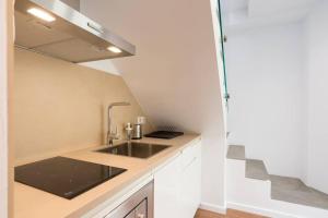 A kitchen or kitchenette at TGH/ Málaga center western style