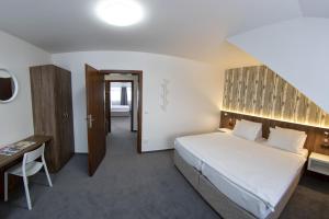 Voodi või voodid majutusasutuse Hotel Prichovice toas