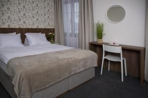Voodi või voodid majutusasutuse Hotel Prichovice toas