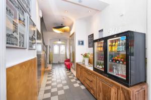a restaurant with a drink cooler in a room at Hotel Wohnbar in Bamberg